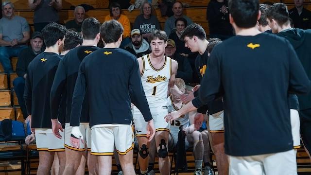 Marcus Tomashek readies for a DII men's basketball game. 