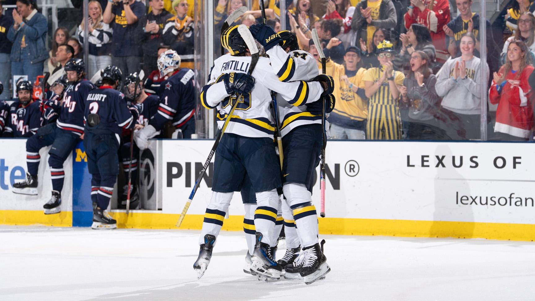 MIchigan hockey celebrates a goal against RMU